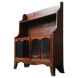 A 19TH CENTURY WATERFALL BOOKCASE, three graduated shelves over two glazed doors