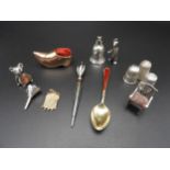 THREE SILVER THIMBLES, THREE NOVELTY PIN CUSHIONS AND A SILVER TOOTH FLASK, along with charms,