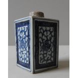 A CHINESE BLUE AND WHITE TEA CADDY, late Qing dynasty, of square form, the four panels decorated