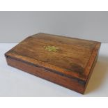 A 19TH CENTURY CROSS BANDED MAHOGANY WRITING SLOPE, the brass inlay bi-fold lid opening to reveal