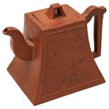 A CHINESE YIXING STONEWARE TEA POT AND COVER, early 20th century, of square bell form, relief