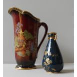 A COALPORT FIELDINGS 'ROUGE ROYALE' JUG AND A ROYAL CROWN DERBY POSY VASE, the gilt decorated jug