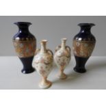 A PAIR OF EARLY 20TH CENTURY ROYAL DOULTON VASES, of baluster form, cobalt blue glaze with a gilt