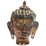 A CAST METAL BUDDHA HEAD, 12cm high