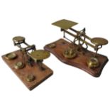A SET OF 19TH CENTURY BRASS LETTER SCALES, by Perry & Co. London, 8 x 18 x 9 cm and another larger