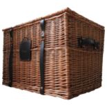 A HARRODS WICKER HAMPER, with material lined interior, leather strap buckle fasteners and label