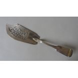 AN EARLY VICTORIAN SILVER FISH SLICE, circa 1844, by William Eaton, London, with pierced scroll