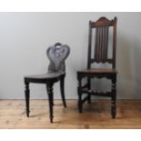 A 19TH CENTURY MAHOGANY HALL CHAIR, with lyre shaped scroll carved back panel, along with an oak