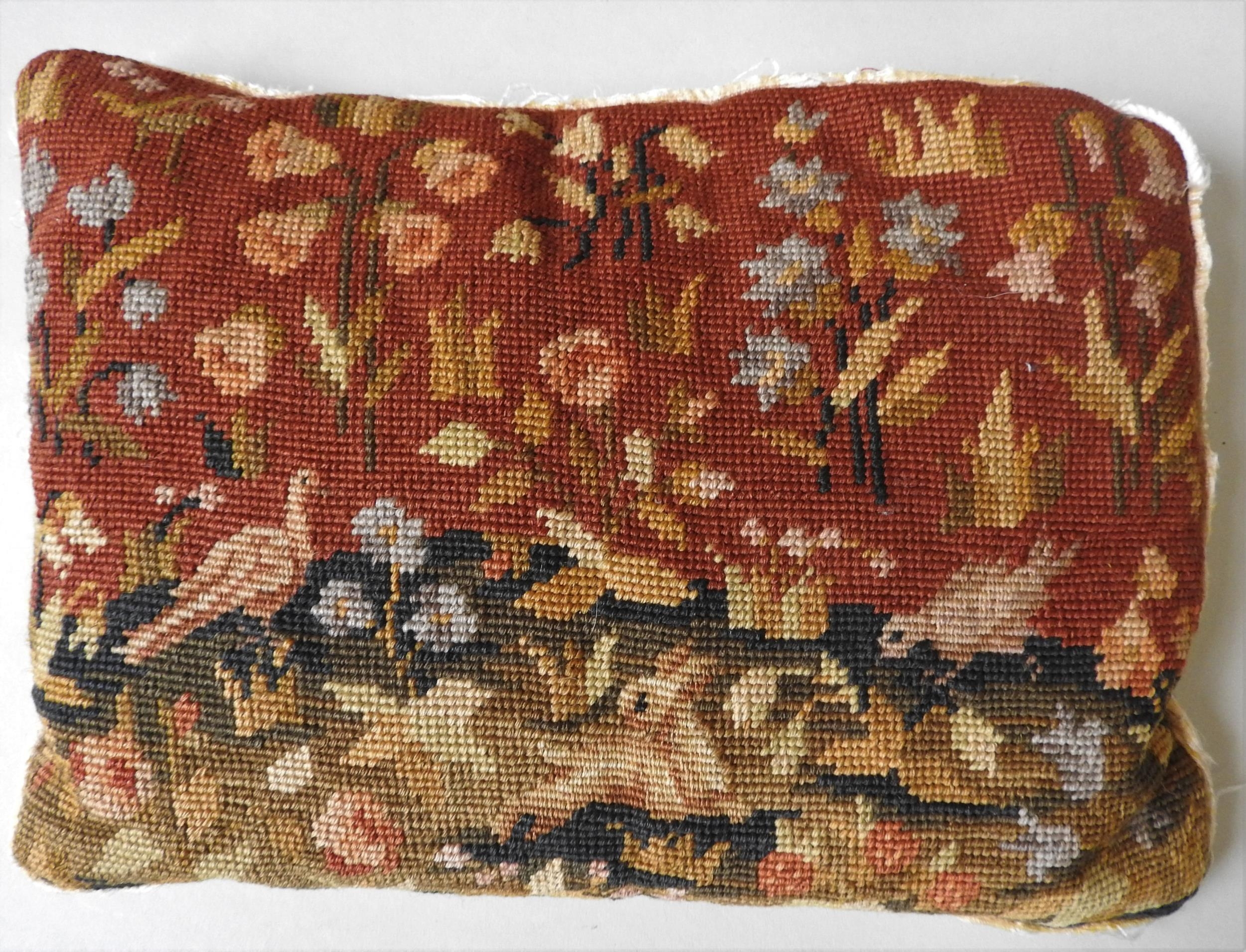 A LATE 18TH / EARLY 19TH CENTURY TAPETRY PANEL CUSHION, depicting rabbit and birds within a floral
