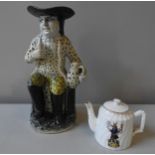 AN EARLY 19TH CENTURY PRATT WARE TOBY JUG, with unusual polka dot pattern to body and handle, 28.5