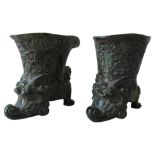 AN IMPRESSIVE PAIR OF CHINESE GREEN SOAPSTONE VASES, the upper vessel carved in relief with dragons,