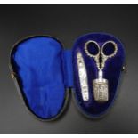 A SILVER THREE PIECE NECESSAIRE, Birmingham 1898, comprising of knife, thimble and scissors, in a