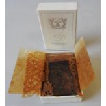 A PIECE OF WEDDING CAKE FROM THE WEDDING OF PRINCE CHARLES AND LADY DIANA SPENCER, in a presentation