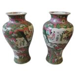 A PAIR OF CHINESE FAMILLE ROSE PORCELAIN VASES, the panels decorated with female figures with