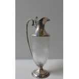 AN ELEGANT LATE 19TH CENTURY SILVER MOUNTED CLARET JUG, circa 1892,the etched glass body decorated