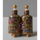 A UNUSUAL CONTINENTAL 'SIDE BY SIDE' DOUBLE SCENT BOTTLE, overlaid with enamel, with vibrant