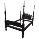 AN AMERICAN 19TH CENTURY FOUR POSTER BED STEAD, with turned baluster supports flanking panelled
