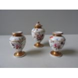 THREE 19TH CENTURY ENGLISH PORCELAIN GILDED VASES, one with a cover, all three of baluster form