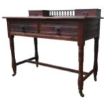 A LATE 19TH CENTURY OAK WRITING TABLE, the leather top with two small drawers united by spindle back