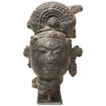 A FINE BLACK STONE HEAD OF A BODHISATTVA CIRCA 11TH-13TH CENTURY, with an elaborate princely