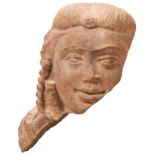 A FINELY CARVED SANDSTONE HEAD FRAGMENT OF A DEITY, PROBABLY NORTHERN INDIAN, with finely detailed