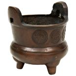 SMALL BRONZE TRIPOD CENSER LATE QING DYNASTY the body of compressed globular form the flared rim