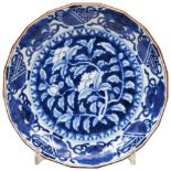 JAPANESE ARITA BLUE AND WHITE BARBED DISH EDO PERIOD, 18TH CENTURY painted with peonies, Buddhist