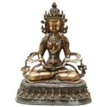 GILT-BRONZE FIGURE OF SEATED TARA SINO-TIBETAN, 18TH / 19TH CENTURY seated in vajrasana on a lotus