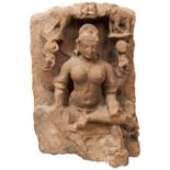 A CARVED STONE MULTI-ARMED FEMALE DEITY, INDIAN, Possibly Lakshmi worn with age and with