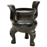 BRONZE TRIPOD CENSER  MING DYNASTY (1368-1644) of compressed globular form with twin upright