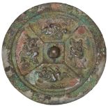 EROTIC BRONZE MIRROR TANG DYNASTY OR LATER the circular mirror cast in relief with amorous couples