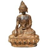 GILT BRONZE BUDDHA LATE QING DYNASTY seated on a lotus base 14cm high