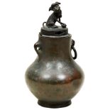 BRONZE BALUSTER VASE 18TH / 19TH CENTURY with an associated cover surmounted by a Buddhist lion 15cm