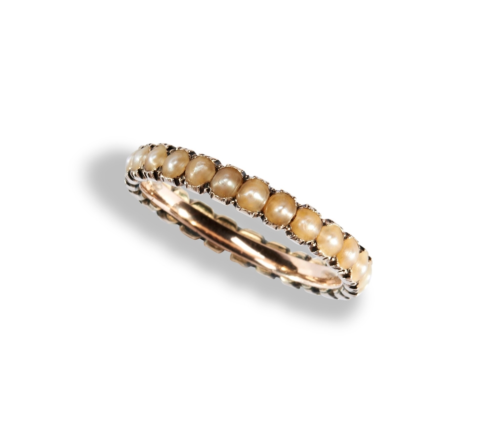 AN EARLY NINETEENTH CENTURY HALF PEARL ETERNITY RING, CIRCA 1830 set throughout with half pearls