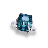A 20TH CENTURY BLUE ZIRCON PLATINUM RING, CIRCA 1950 the emerald-cut, cut cornered zircon four