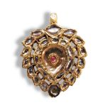 A NINETEENTH CENTURY INDIAN WHITE STONE AND GOLD PENDANT the central red foiled jargon within a