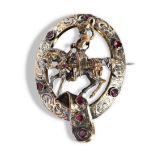 A LATE VICTORIAN SILVER, PASTE AND GILT BROOCH  the horse and Knight set within an oval garter