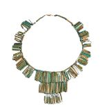 AN ANCIENT EGYPTIAN FAIENCE BEAD NECKLACE composed of pale blue green cylindrical faience beads