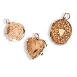 THREE VICTORIAN YELLOW METAL ENGRAVED LOCKETS, CIRCA 1890  an oval, heart, and round engraved