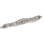 A DIAMOND BAR BROOCH CIRCA 1900 set to the centre with a millegrain collet set old brilliant-cut