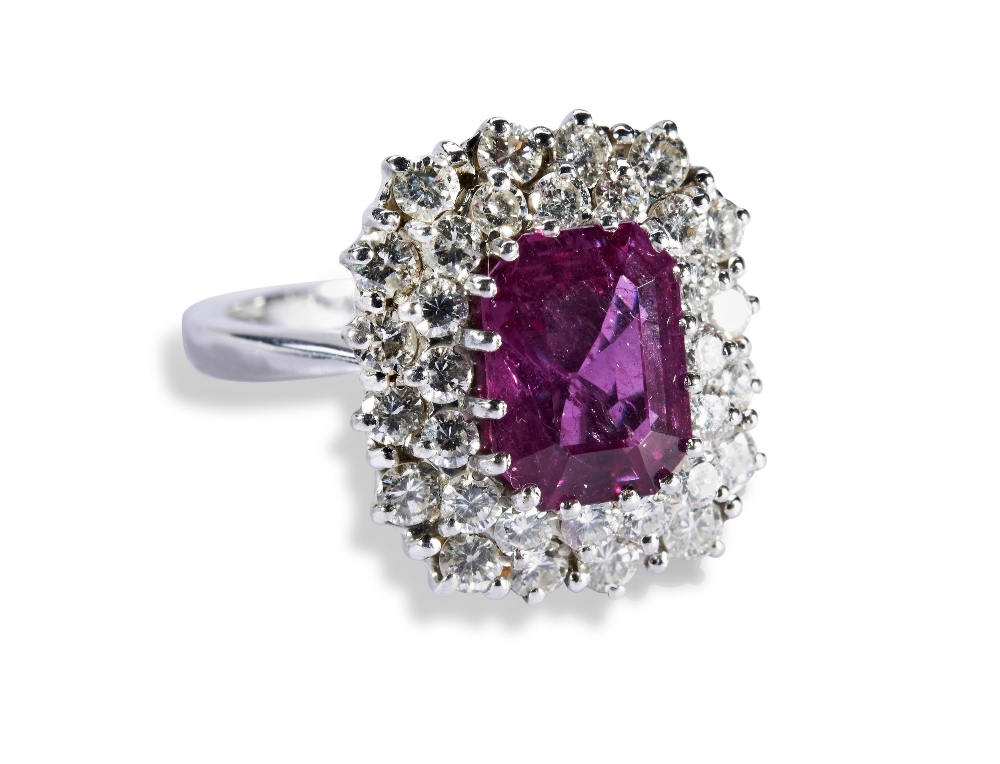 A PINK SAPPHIRE AND DIAMOND RING, the emerald-cut sapphire within a double border of brilliant-cut - Image 2 of 3