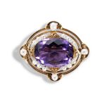 AN ART NOUVEAU GOLD AMETHYST AND PEARL BROOCH, CIRCA 1890 the oval cut amethyst in undulating gold