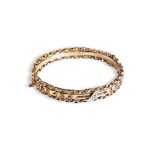 A VICTORIAN GOLD BANGLE, CIRCA 1890 with chain link decoration either side of a plain polished