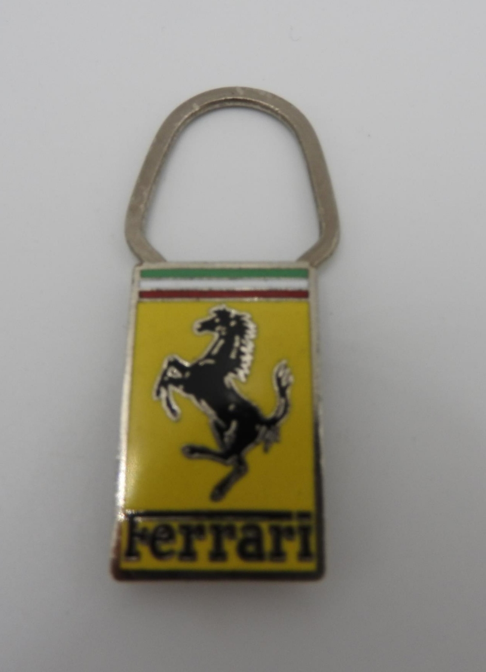 PERIOD FERRARI KEYRING AND PIN BADGES FERRARI KEYRING IN WAXED PAPER PACKET  Rare period Ferrari