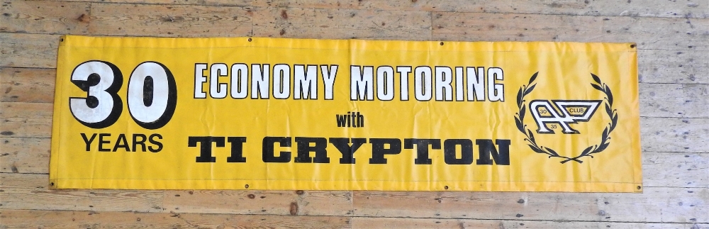 ECONOMY MOTORING WITH TI CRYPTON BANNER In yellow vinyl with white and black lettering, in