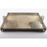 Extreme decorative large tray with feet and broken finished border with floral decor as well handles