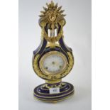 Victoria & Albert Museum reproduction 'Marie-Antoinette' lyre clock, with cobalt blue porcelain case