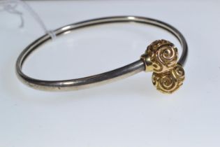 Yellow metal & silver bangle, unmarked, yellow metal tests positive for 9ct gold, 10.43 grams 