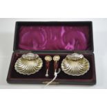 Cased pair of late Victorian silver scallop-shaped salts & spoons, maker WA, Chester 1899, gross wei