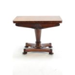A Victorian rosewood pedestal games table. With carved flower detail font apron, raised on twist bun